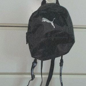 Black with silver brand puma little bag